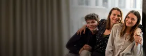 A mother embracing her two children